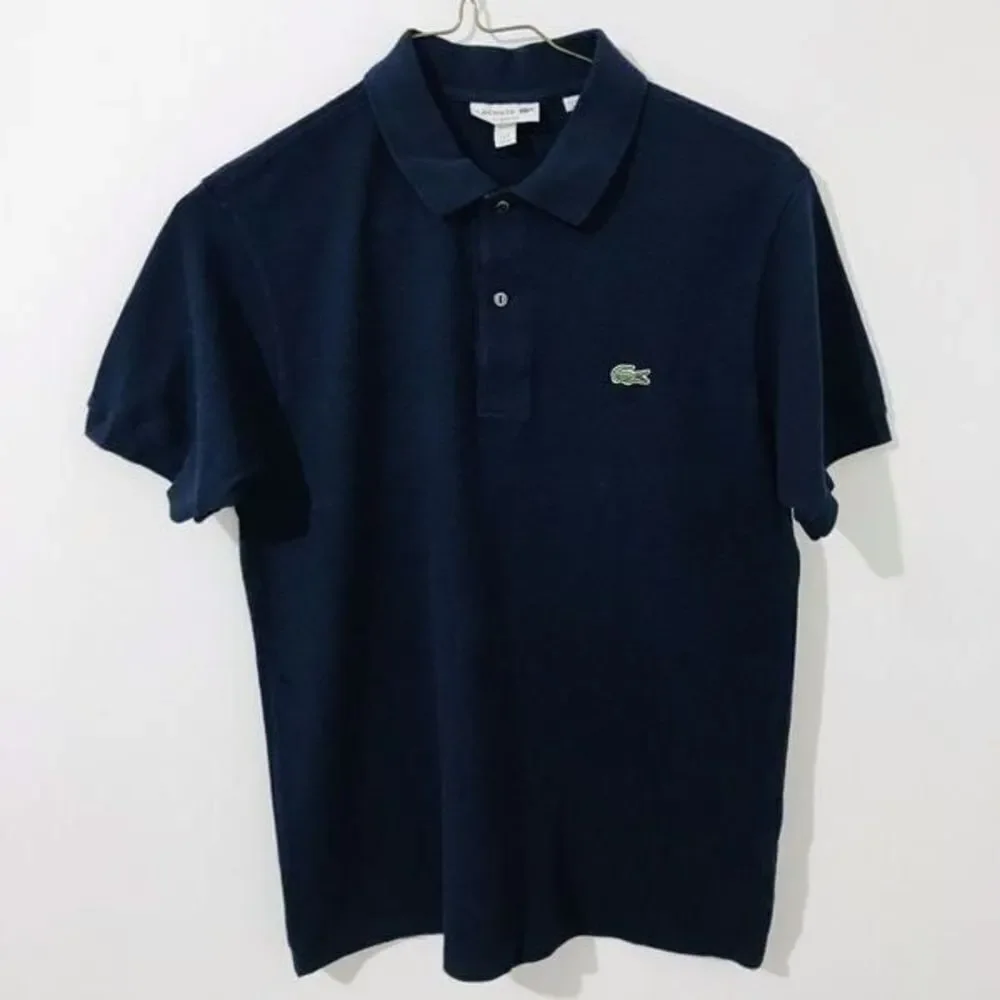 Lacoste dark blue polo shirt size M kids.    A302